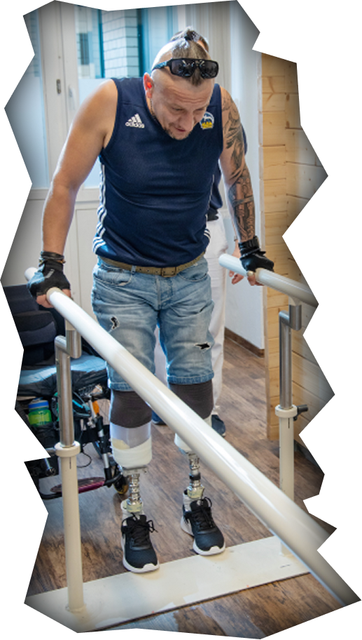Ukrainian war amputee during rehabilitation with prosthetic legs